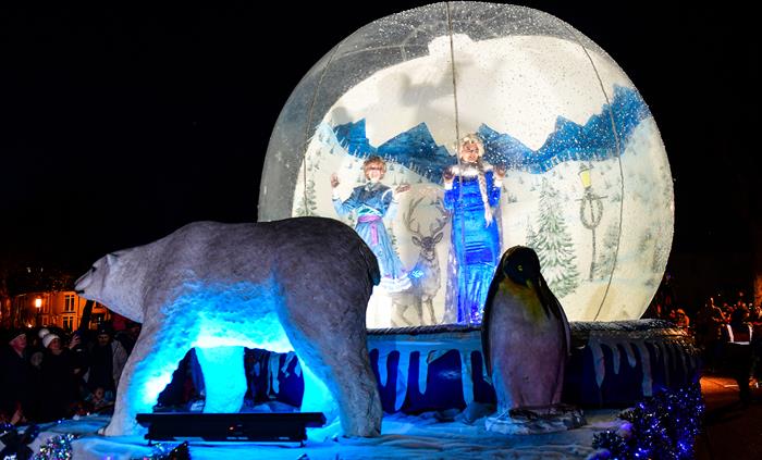 Favourite characters in a snow globe with a giant polar bear and penguin, taking part in the Swansea Christmas Parade